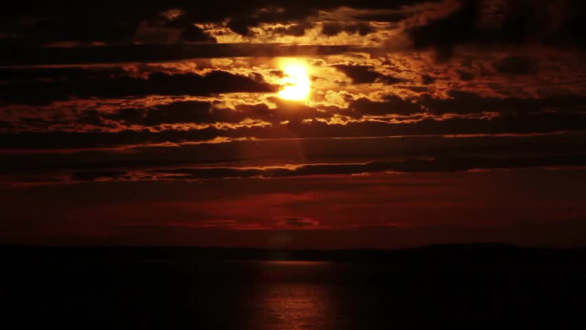 Beautiful orange and black sunset over Georgian Bay, in Parry Sound, Ontario.