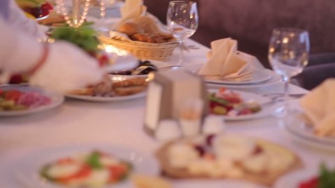 Waiter Serves  Banquet Table