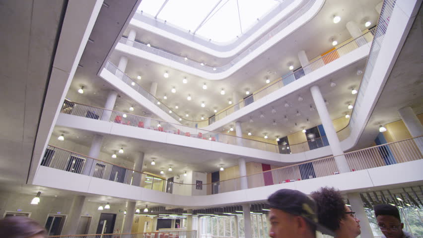 Diverse group of students in large modern university building