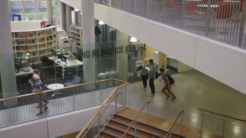 Diverse group of students in large modern university building