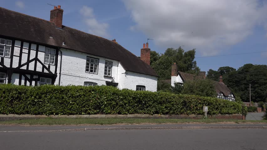 TONG, SHROPSHIRE, ENGLAND - JULY 2014: traditional english village black and white houses