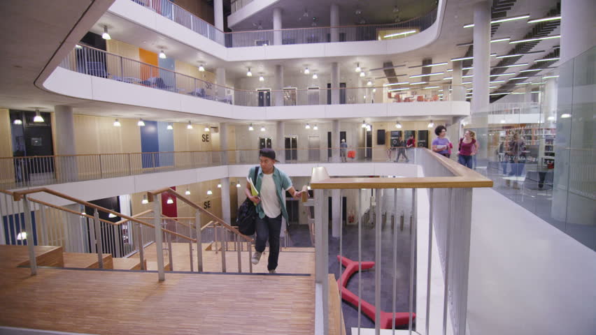 Diverse group of students working together in study area of modern university