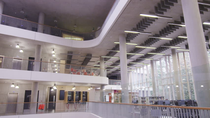 Diverse group of students working together in study area of modern university