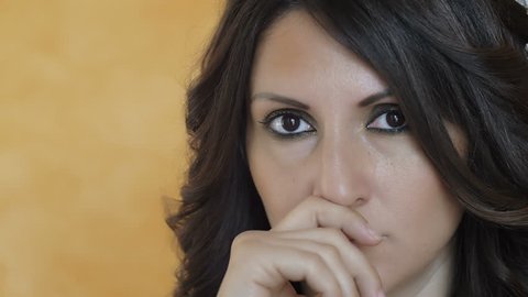 close up portrait of young handsome pensive woman: thinking, 4k footage