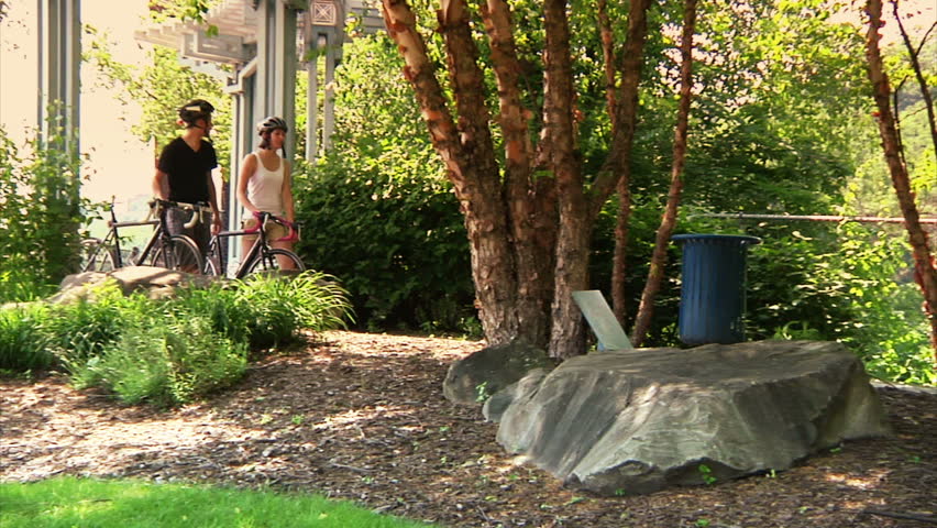 A young couple bike and sightsee on the bike trails on Washington