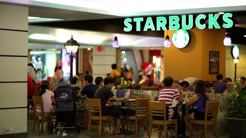 Kuala lumpur, malaysia - circa june 2014: starbucks coffee at berjaya time  square (shopping complex). starbucks corporation is an american global  coffee company and coffeehouse.