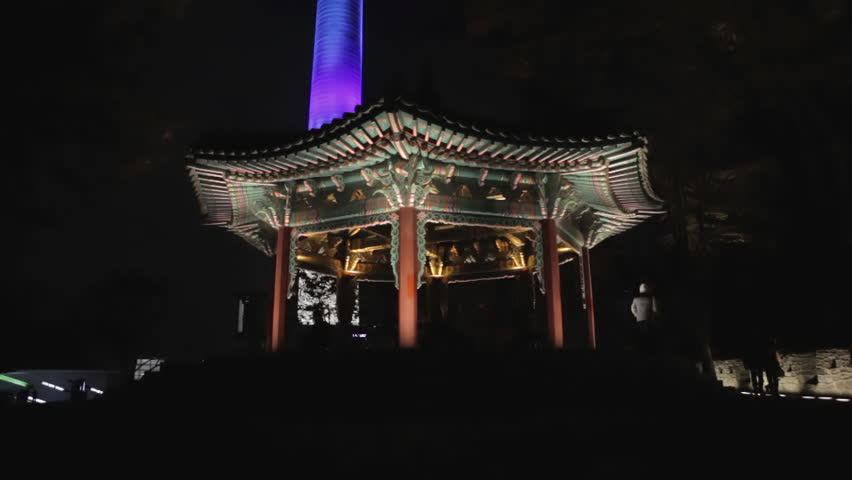 Ancient temple on Namsan Park hilltop, tilt to North Seoul Tower  / Seoul, South Korea