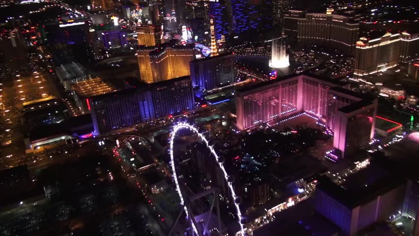 Aerial Vegas High Roller, Linq, and Bellagio Fountains 

Aerial imagery of the Las Vegas Strip, see  tallest observation wheel the High Roller, the Linq , as well as the classic Bellagio Fountains.