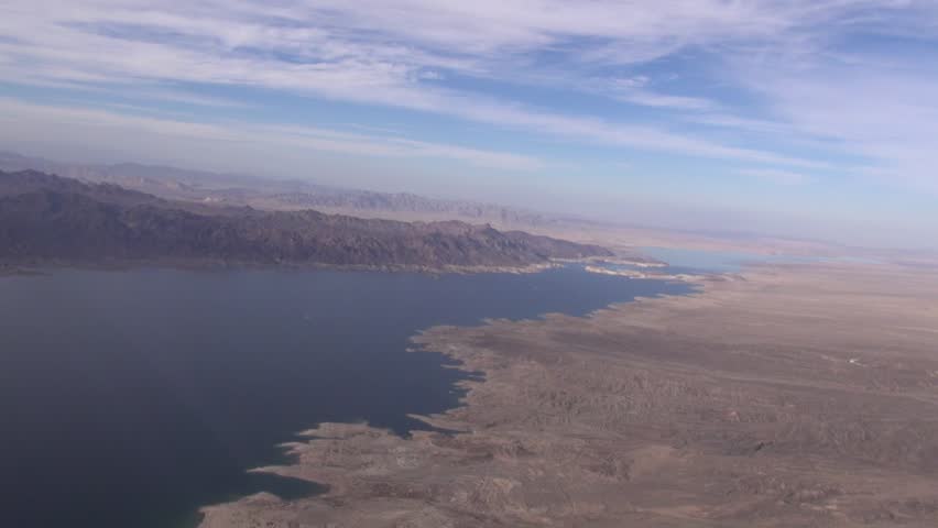 Lake Mead is a tourism areas in Nevada, the largest man-made lake in the world.   Behind Hoover Dam, we pan over Calville Bay.  Lake Mead