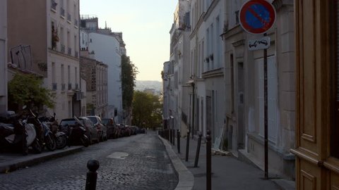 PARIS FRANCE- JULY 2, 2014:  Typical Parisian street of the neighbourhood of Montmartre, Paris: stockvideo