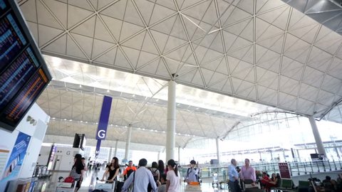 HONG KONG, CHINA - CIRCA JUNE 2014: Departures board at the Hong Kong International Airport. The Hong Kong airport handles more than 70 million passengers per year. 