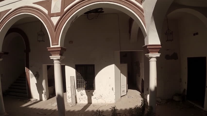 Aerial lateral travelling of an old and beautiful courtyard. Seville, Spain. HD
