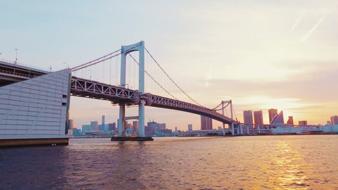 Tokyo's famous Rainbow Bridge taken from a boat on the Sumida River at sunset