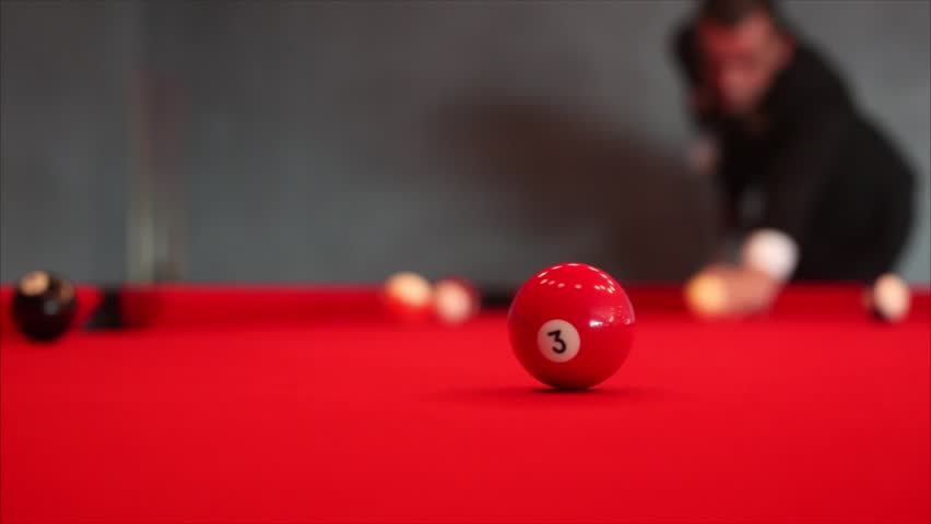 A guy plays billiard / Hit the ball