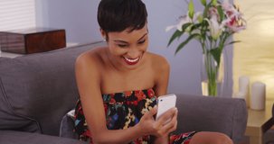 Pretty black woman webcamming on smartphone