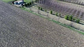 Farmland aerial shot in flight of corn fields in Midwest United States. Perfect for videos about farming, crops, land, rural America or food production.