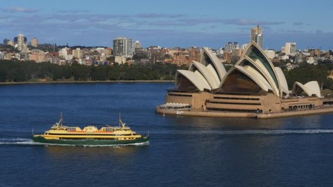 SYDNEY, AUSTRALIA - JULY 1 2014: panning shot of the sydney opera house and the harbour from the bridge