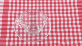 HD 1080p: Tea pouring on red and white checkered tablecloth - Powered by Shutterstock - Get 15% off with code: PIKWIZARD15