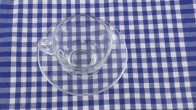 HD 1080p: Tea pouring on blue and white checkered tablecloth - Powered by Shutterstock - Get 15% off with code: PIKWIZARD15