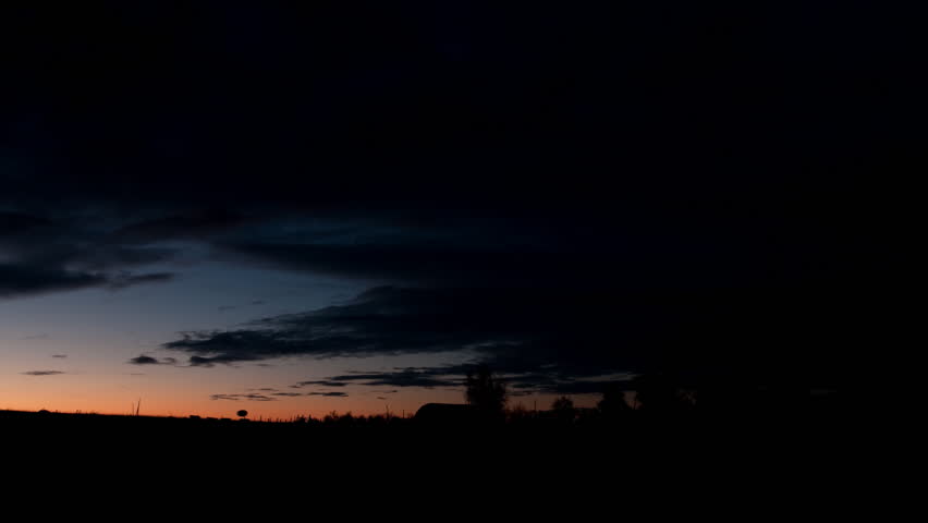 Colorful sunrise time lapse over farm in eastern Colorado. HD 1080p.