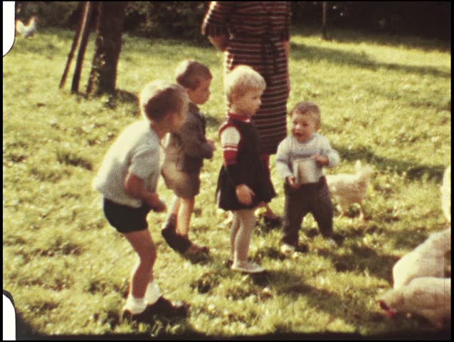 Children feeding the chicken (vintage 8 mm film from the 1960s) | Shutterstock HD Video #682996