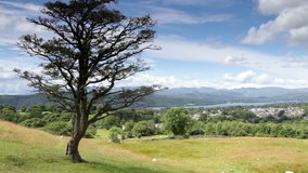 Summer landscape in Cumbria with Lake Windermere and surrounding mountains in the Lake District, UK. Video shot with Canon 5D Mark II.