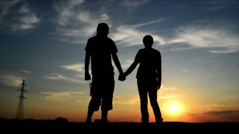 Lovers on a date in sunset, holding hands. Romantic love scene. 1920x 1080 full hd footage.