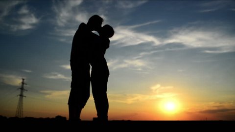 Lovers on a date in sunset, hugging and kissing. Romantic love scene, 1920x 1080 full hd footage.