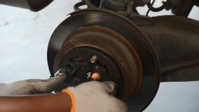 fix disc brake of car at garage