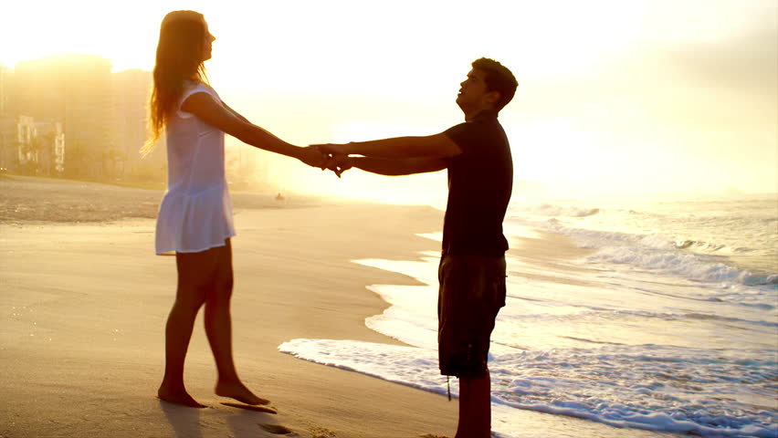 Loving couple embrace on a beach | Shutterstock HD Video #6834877