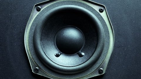 Close-up at moving sub-woofer. Speaker sub-woofer moving from loud music.
