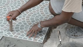dolly of worker making tile for floor construction