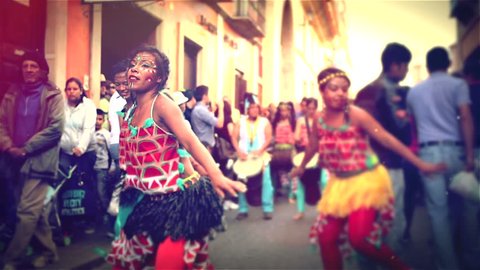 GUANAJUATO, MEXICO CIRCA MARCH 2014: African dance group making a performance on the  crowded street during a Celebration of cultures 