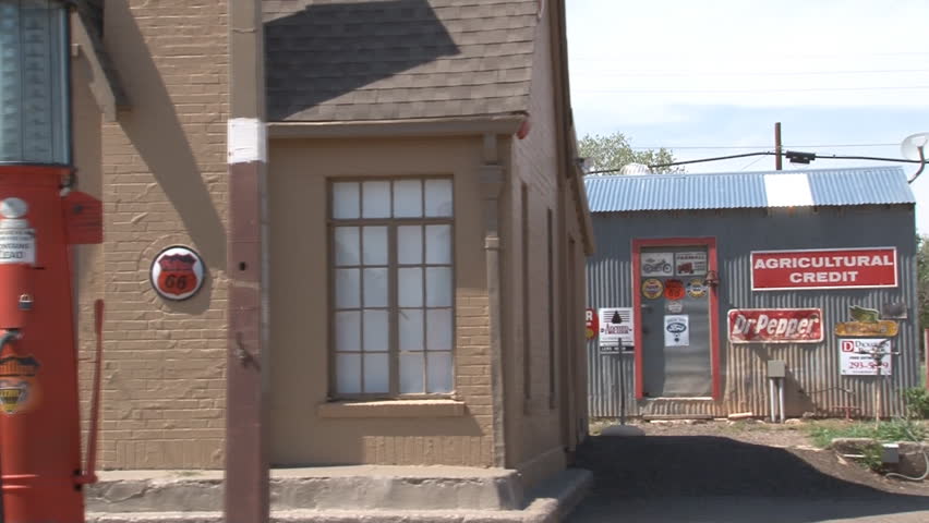 Daytime tracking shot of historical "filling station" with 1920s era pumps located in downtown Turkey, in the panhandle of Texas.