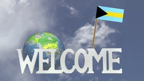 The word WELCOME in front of a turning globe and moving clouds in a blue sky with tooth pick and a small paper flag of BAHAMAS