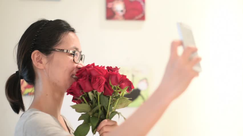 Take photos  with flower bouquet.