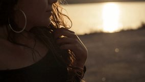 Beautiful young woman at sunset. Close-up, shallow DOF. RAW video record.