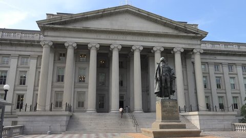 WASHINGTON, DC - MAY 2014: US Treasury Department, person enters building,  at west entrance (Pennsylvania Ave), one of  the building's two "fronts."