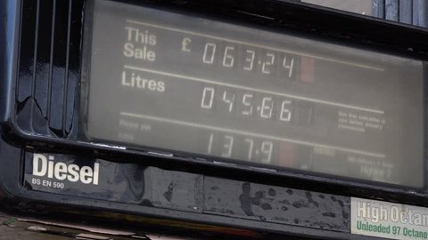 Fuel pump showing Pounds sterling and litres going up. UK England Fuel Price Inflation - 02666698
