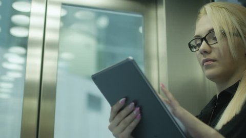 Pretty Woman Using Tablet PC in Elevator. Shot on RED Digital Camera in 4K, so you can easily crop, rotate and zoom.
ProResHQ codec - Great for editing, color correction and grading.

