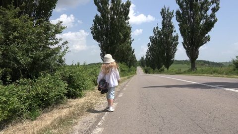 Ultra HD 4K Little Girl Walking Non Urban Road, Traffic, View of an Isolated Runaway Unhappy Child, Countrywoman Wandering in Countryside, Village, Children and Childhood