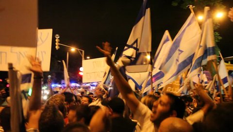 HAIFA, ISRAEL - JULY 20: Jews, right wing activists, fascist, demonstrate against pro Palestinians in anti war protest against the invasion of Israel to Gaza in Haifa Israel, 20 July 2014