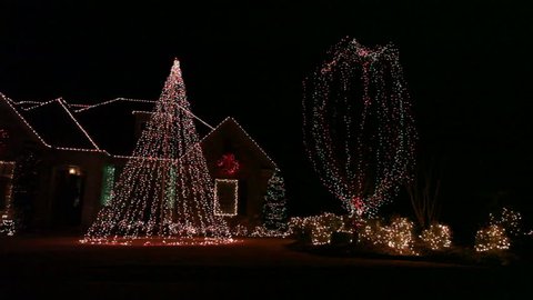 Dynamic illumination of the house exterior during Christmas in the dark Stock Video