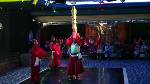MONASTIR, TUNISIA - CIRCA MAY, 2012: Tunisians dance during evening show for tourists in hotel lobby