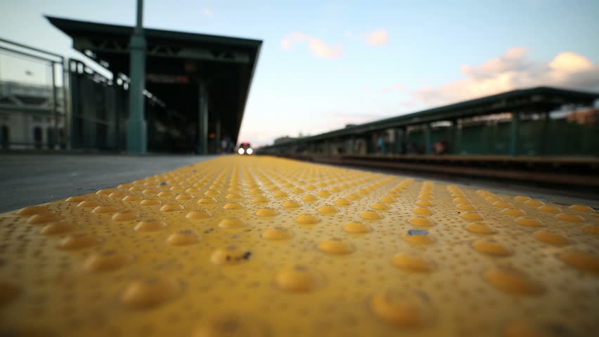 Subway Train Pulls into Elevated Platform in the Bronx, New York City