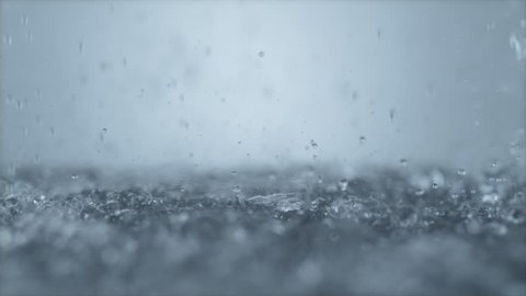 Heavy rain on water surface. Shot with high speed camera, phantom flex 4K. 4K 30fps. Slow Motion.