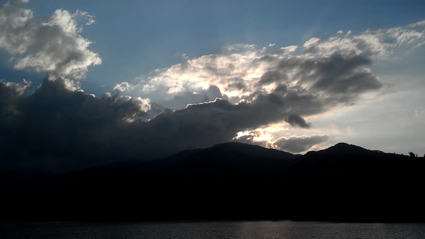 sunset and stormy clouds over lake santeetlah north carolina
