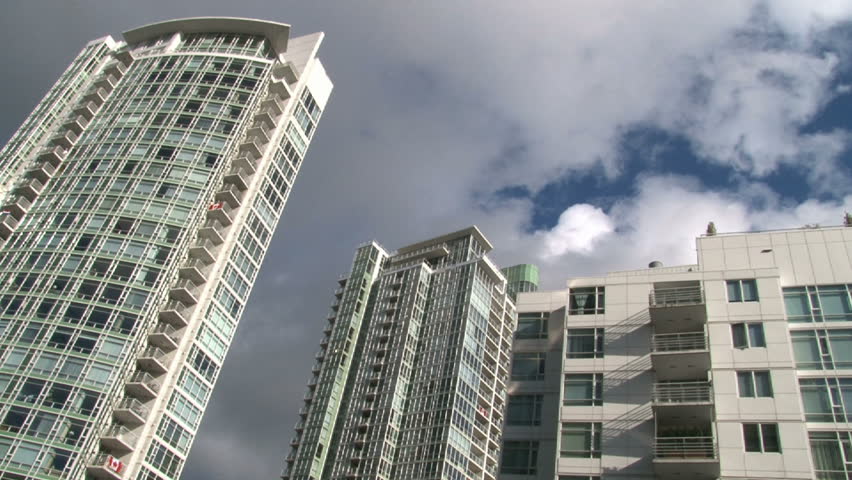 Time lapse of tall condominiums in Vancouver Canada during beautiful partly
