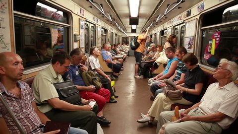 KIEV, UKRAINE - JULY 26, 2014: Passengers in the subway car.