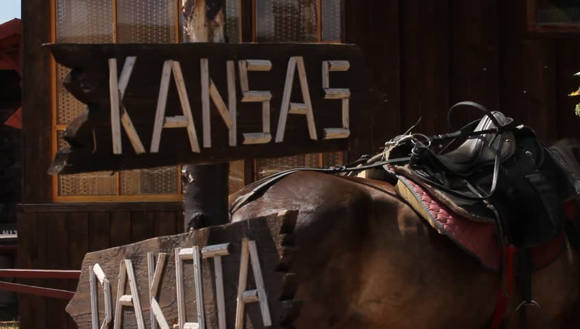 Sign to Kansas and dacota on horse background